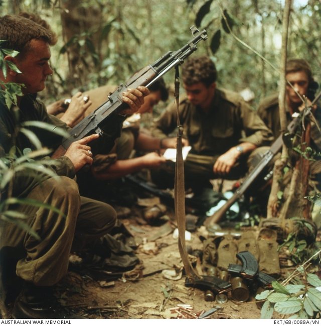 Australian soldiers of 7RAR with a captured Type 56 rifle during Operation Coburg, Vietnam, February 1968.
